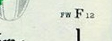 Close-up of the face plate number FW F12 at the lower right of a two-dollar bill
