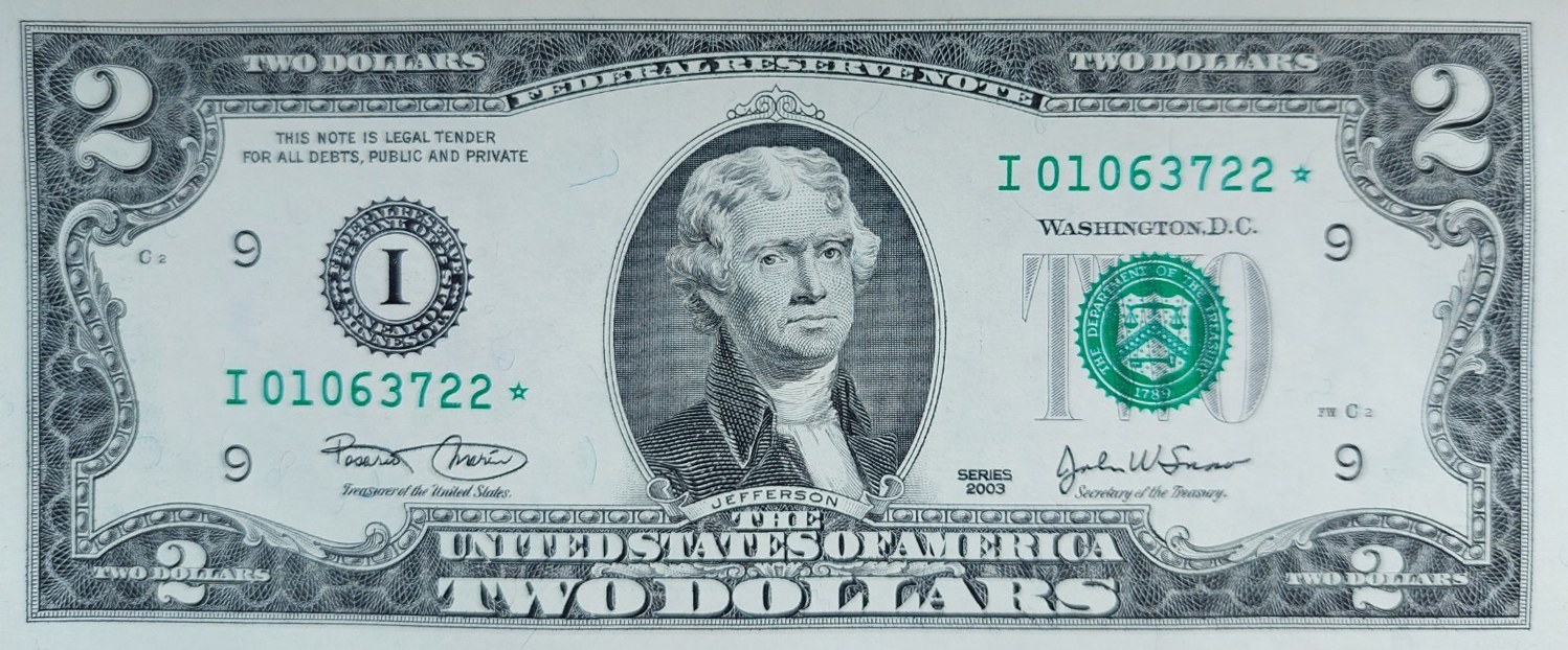Series 2003 two-dollar star note face, Minneapolis district, serial I01063722 followed by a star, Marin and Snow signatures