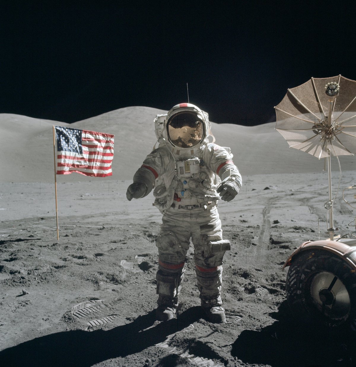 Astronaut Gene Cernan standing on the Moon beside the flag during Apollo 17, December 1972