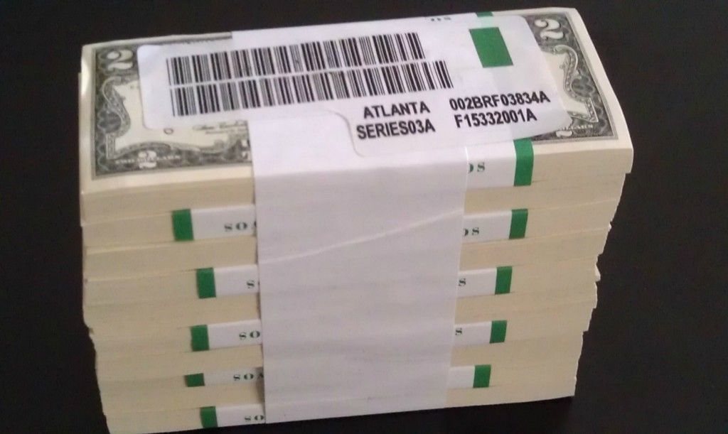 A shrink-wrapped brick of ten straps of $2 notes labeled Atlanta, Series 03A